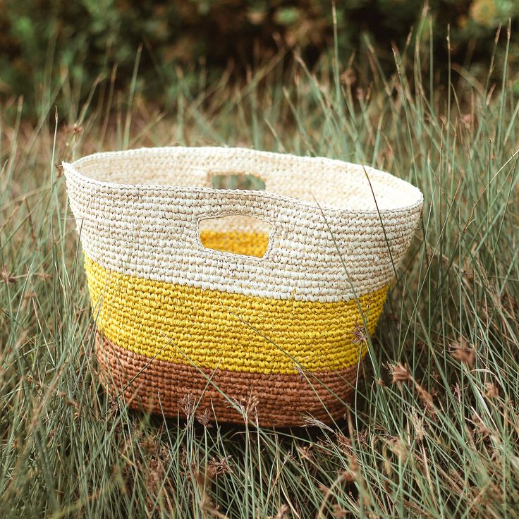 Our classic Sayan raffia bag is perfect for the sunnier month. Made from natural raffia straws in a warm tropical color combination. Carry it to the beach or for your next island getaways. Top Width: 18 inchesBottom width: 12 inchesHeight: 10.5 inchesDepth: 5 inchesMade by artisans in Bali Yellow Handwoven Beach Bag, Eco-friendly Yellow Crochet Bag For Vacation, Handwoven Yellow Straw Beach Bag, Yellow Handwoven Straw Bag For Summer, Summer Yellow Handwoven Straw Bag, Yellow Handwoven Crochet Bag For Vacation, Rectangular Yellow Straw Bag For Beach, Fair Trade Summer Straw Bag For Vacation, Summer Straw Bag For Vacation, Fair Trade