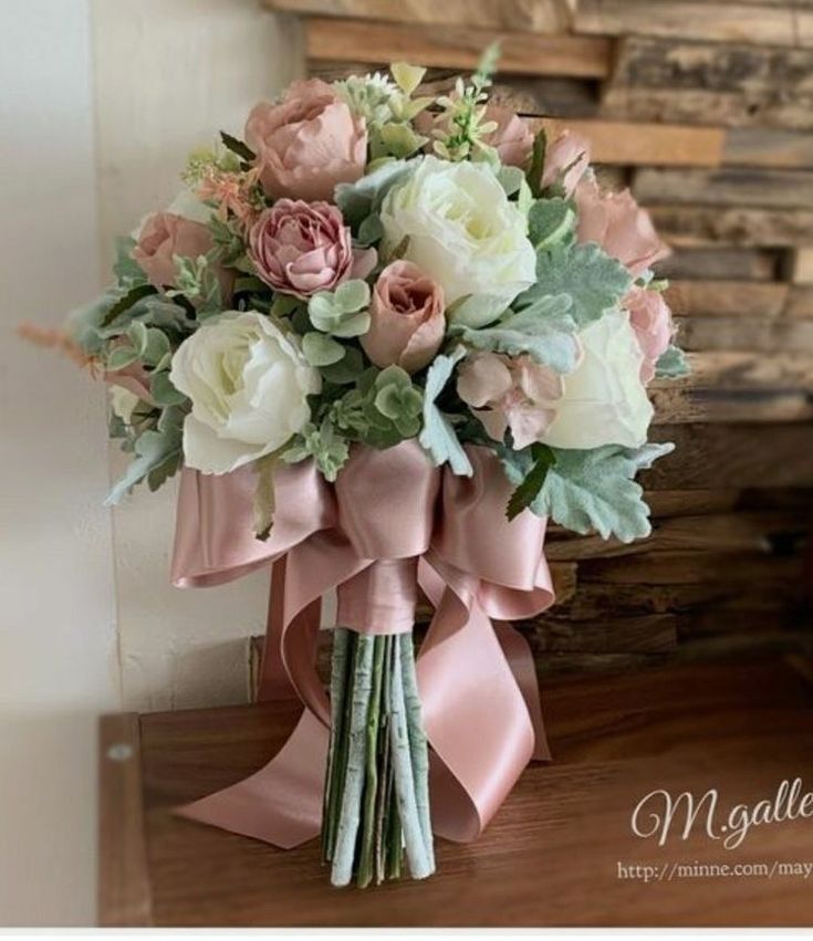 a bridal bouquet with pink and white flowers