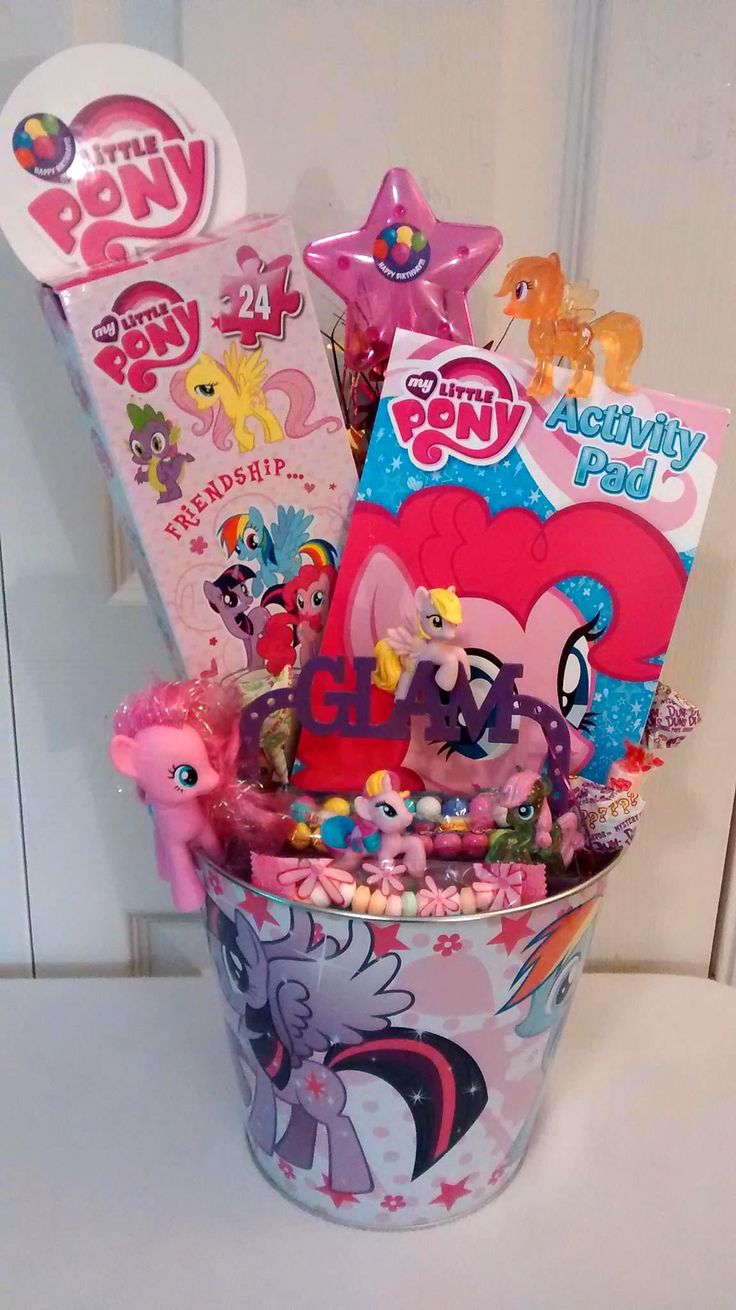 a bucket filled with lots of toys and candy