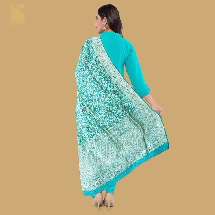 Step into regal elegance with our Shikargah Katan Silk Dupatta. Inspired by the wilderness, its intricate motifs and luxurious silk weave add opulence to any outfit. Whether paired with a plain kurta or embroidered ensemble, this dupatta exudes refined charm, perfect for festive occasions. Traditional Kurta With Meenakari, Unstitched Silk Kurta For Ceremonial Occasions, Designer Meenakari Jamawar Kurta, Elegant Banarasi Silk Meenakari Sets, Traditional Anarkali Set With Meenakari On Straight Kurta, Traditional Straight Kurta Anarkali Set With Meenakari, Elegant Meenakari Banarasi Silk Sets, Elegant Anarkali Set With Zari Weaving, Elegant Banarasi Silk Kurta With Zari Work