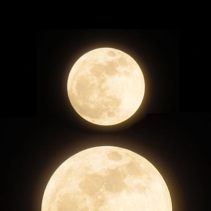 two full moon are shown in the dark sky