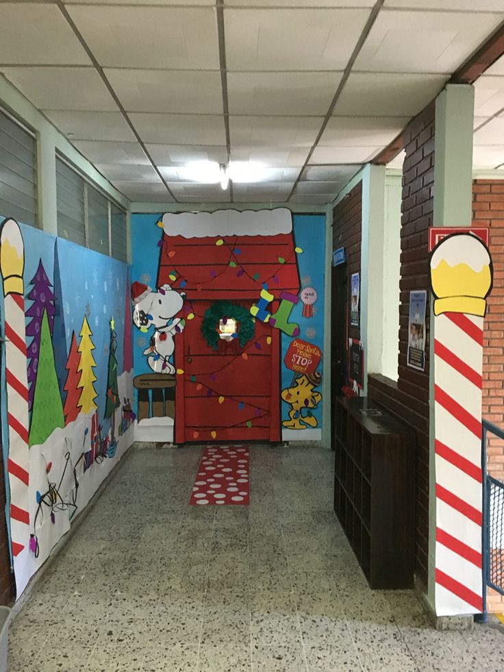 the hallway is decorated with christmas decorations and cartoon characters on the walls, along with an area rug