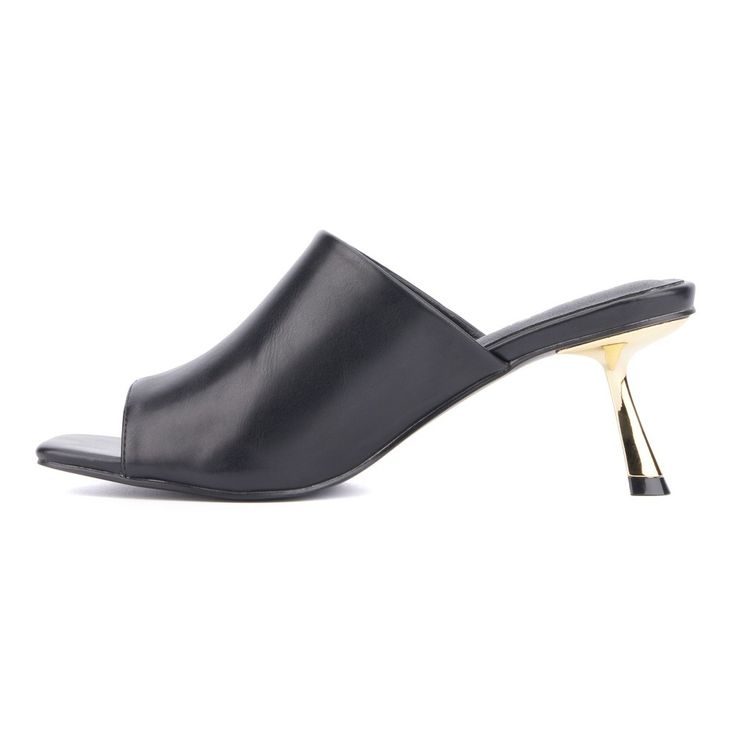 Always look fashion-forward in the Idina. Featuring a slanted heel and open toe mule design, this shoe exudes style and sophistication. The sleek and modern silhouette makes the Idina a standout addition to any outfit, perfect for both casual and formal occasions. With its unique design and comfortable fit, the Idina ensures you stay chic and confident wherever you go. Step into elegance and make a bold fashion statement with these must-have mules. Sleek Evening Mules With Sculpted Heel, Chic Spring Kitten Heels For Night Out, Elegant Mules With Sculpted Heel For Night Out, Sleek Open Toe Kitten Heels For Evening, Sleek High Heel Mules For Formal Occasions, Formal Open Toe Mules With 4-inch Heel, Sleek High Heel Formal Mules, Chic Sandals With Sculpted Heel For Night Out, Chic Mules With Padded Heel For Cocktail