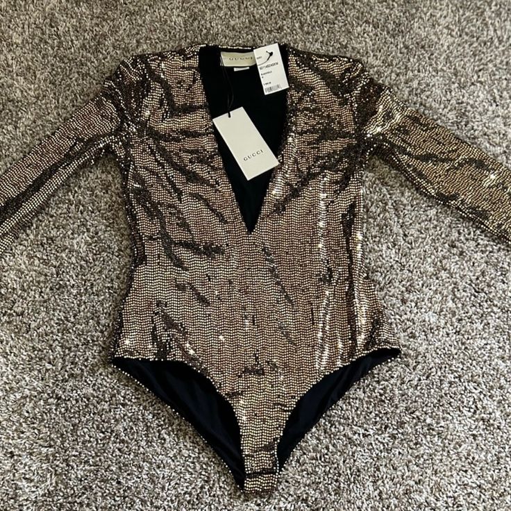 Gucci Size Medium Gold Black Polyamide Blend Metallic Bodysuit Dress Top Gg Tulle Bodysuit Gucci Luxury Party Bodysuit, Luxury Black Party Bodysuit, Chic Evening Bodysuit For Party Season, Luxury Fitted Bodysuit For Party, Gold Long Sleeve Bodysuit For Night Out, Elegant Evening Bodysuit For Party Season, Gold Elegant Bodysuit, Gold Elegant Evening Bodysuit, Elegant Gold Evening Bodysuit