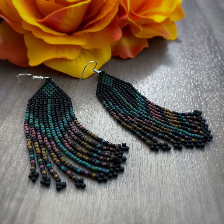 Southwestern style beaded fringe earrings made with Toho seed beads. Southwestern Fringe Dangle Earrings, Southwestern Beaded Earrings With Tassels For Festival, Southwestern Multicolor Fringe Earrings, Southwestern Fringe Earrings With Round Beads, Bohemian Black Beaded Necklaces With Fringe, Bohemian Black Beaded Necklace With Fringe, Bohemian Black Beaded Fringe Necklace, Southwestern Beaded Fringe Dangle Earrings, Southwestern Style Beaded Fringe Dangle Earrings