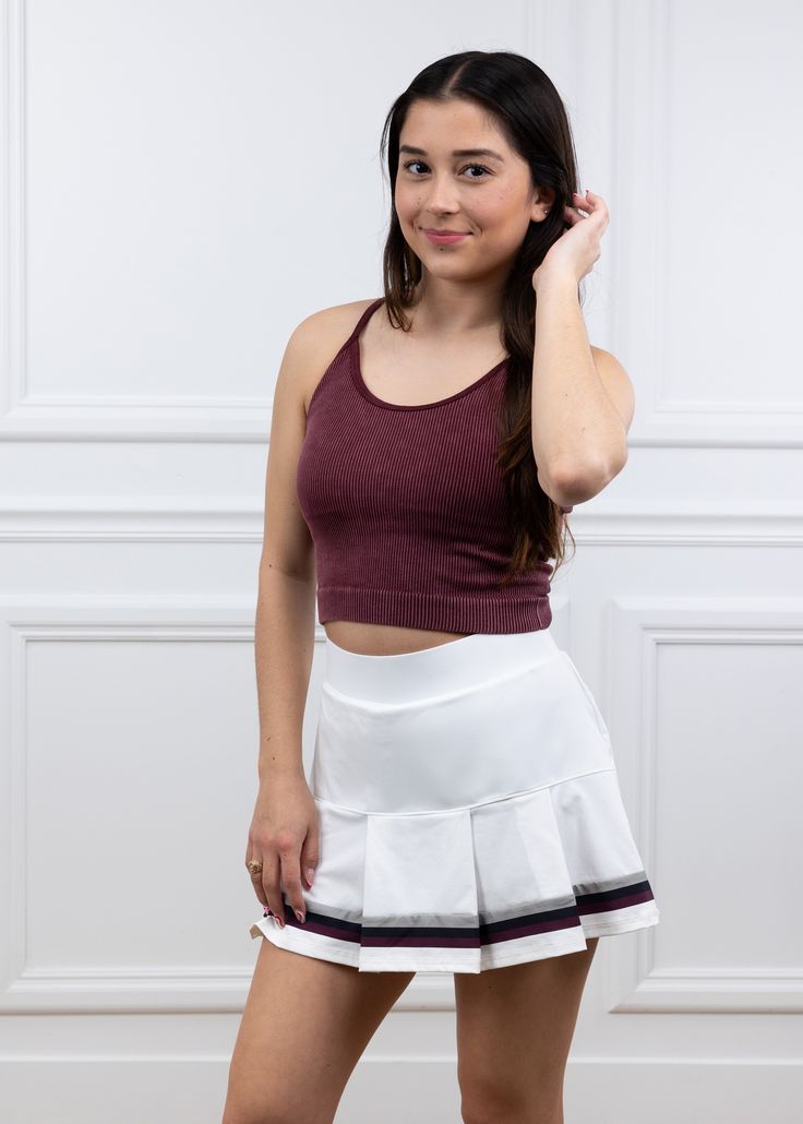 Experience the ultimate in comfort and style with our Performance Pleated Stripe Skirt! Made with breathable, high-performance fabric, this skirt will keep you cool and stylish all day long. The pleated design provides a flattering and comfortable fit, and the maroon and gray stripe adds a touch of sporty elegance. Elevate your athletic wardrobe with this must-have piece! - Brand: Sport Haley - Outer: 86% Nylon/14% Spandex - Inner: 90% Polyester/10% Spandex - Machine Wash Cold/Tumble Dry Low Mod Sports Mini Pleated Skirt, Summer Athleisure Pleated Skirt, Sports Stretch Pleated Skirt, Stretch Pleated Sports Skirt, Stretch Pleated Tennis Skirt For Workout, Stretch Pleated Skirt For Sports, Summer Sports Pleated Skirt, Summer Workout Pleated Skirt, Casual Pleated Skirt For Sports In Summer