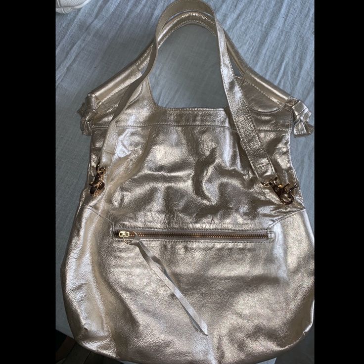 Kept In Great Condition Never Used Champagne Metallic From Top Of Handle To Bottom Of Bag: 18inches Handle Type: Convertible (Hand Bag/Crossbody) Removable Shoulder Strap Included Gold Shoulder Bucket Bag With Gold-tone Hardware, Gold Shoulder Bucket Bag For Shopping, Elegant Gold Bucket Bag For Everyday Use, Elegant Gold Bucket Bag For Everyday, Gold Bucket Shoulder Bag With Detachable Strap, Gold Bucket Bag With Gold-tone Hardware Satchel, Gold Satchel Bucket Bag With Gold-tone Hardware, Gold Crossbody Bucket Bag With Gold-tone Hardware, Gold Hobo Bag For Everyday Use