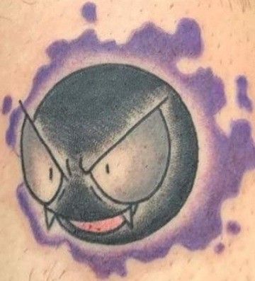 an image of a cartoon character tattoo on the back of a man's shoulder