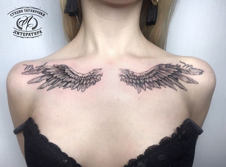 a woman's chest with two wings on it