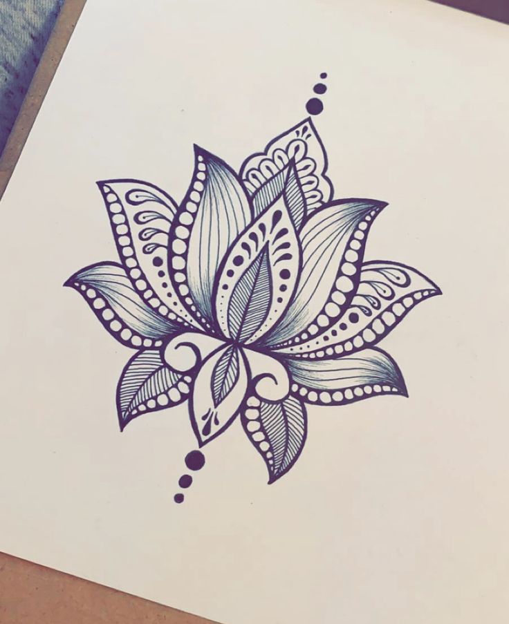 a drawing of a blue flower on white paper