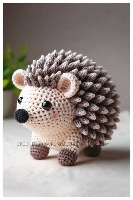 a small crocheted hedge toy sitting on top of a table