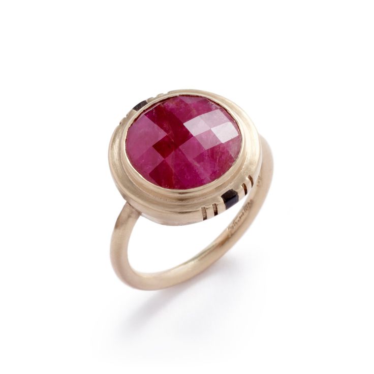 A chunky and sophisticated ring from bezel-set fair trade natural ruby and Oregon black jasper inlay in 14k gold. Designed and made in our Portland studio. Most rubies on the market have been heat treated to remove their crystal inclusions and to alter the color by allowing more light to pass through. We're using untreated rubies in these rings. While traditional treated rubies are beautiful, we think the inclusions and color variations found in these natural rubies retains a uniqueness and a co Luxury Ruby Ring With Round Stone, Heirloom Style Ruby Ring, Timeless Round Ruby Ring, Ruby Birthstone Ring In Yellow Gold, Elegant Faceted Ruby Ring In Yellow Gold, Elegant Yellow Gold Faceted Ruby Ring, Timeless Polished Ruby Ring, Ruby Birthstone Ring With Polished Finish, Heirloom Ruby Ring In Round Shape