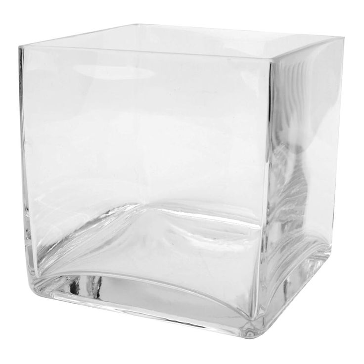 a clear square vase sitting on top of a white table