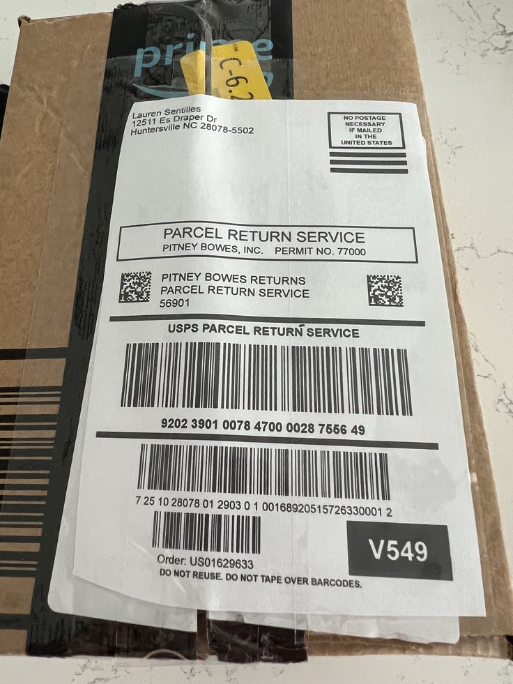 a package is sitting on top of a cardboard box with a bar code attached to it