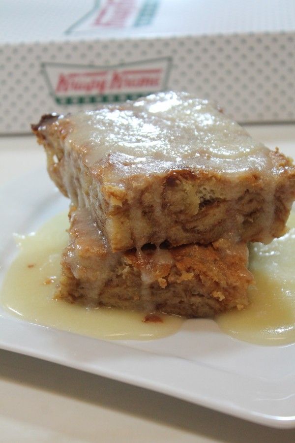 two pieces of cake sitting on top of a white plate covered in icing and sauce