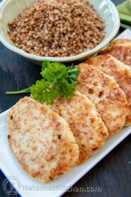 some food is sitting on a plate and next to a bowl of brown lentils