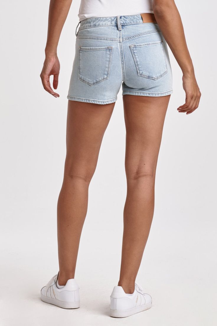 Classic denim mid rise shorts with clean hem. The flirt fit with a wink, sits a touch lower on the waist and playfull hugs every curve from hip and thigh. Shorts inseam on comfort stretch denim accented with designer abstract floral embroidery, in effortless light shade for any outings with buttery softness.9 1/4" Front Rise (include waistband), 22" Leg Opening, 3 1/4" inseam (Size 27) COMFORT STRETCH: Slightly snug, give sometime to ease in, may go up one size 98% COTTON 2% SPANDEX Machine wash Fitted Shorts With Frayed Hem, Mid-rise Light Wash Shorts With Frayed Hem, Fitted High-waisted Shorts With Frayed Hem, Mid-rise Fitted Jean Shorts With Frayed Hem, Fitted Mid-rise Jean Shorts With Frayed Hem, Fitted Medium Wash Shorts, Mid-rise Light Wash Jean Shorts, Trendy Fitted Cutoff Shorts, Light Wash High Rise Fitted Jean Shorts