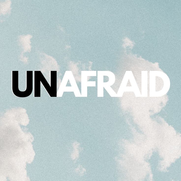 the word unafraid against a blue sky with white clouds in the foreground