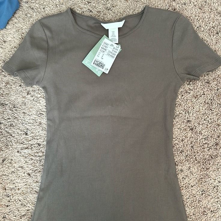 H&M Ribbed T-Shirt. Brand New With Tags H&m Basic Short Sleeve T-shirt, Basic H&m Short Sleeve T-shirt, Basic Short Sleeve T-shirt By H&m, H&m Short Sleeve Summer Top, Green Cotton H&m Tops, H&m Stretch Short Sleeve Tops, H&m Fitted T-shirt For Spring, H&m Fitted Short Sleeve Tops, Fitted H&m T-shirt For Spring