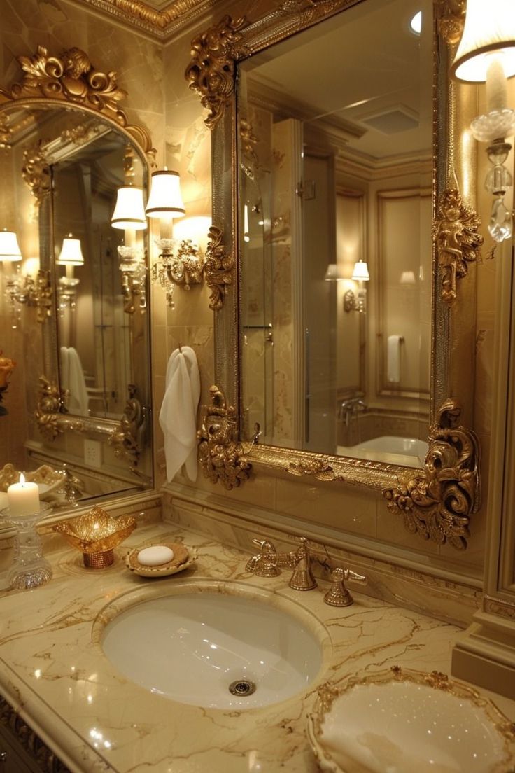 a fancy bathroom with two sinks and large mirrors