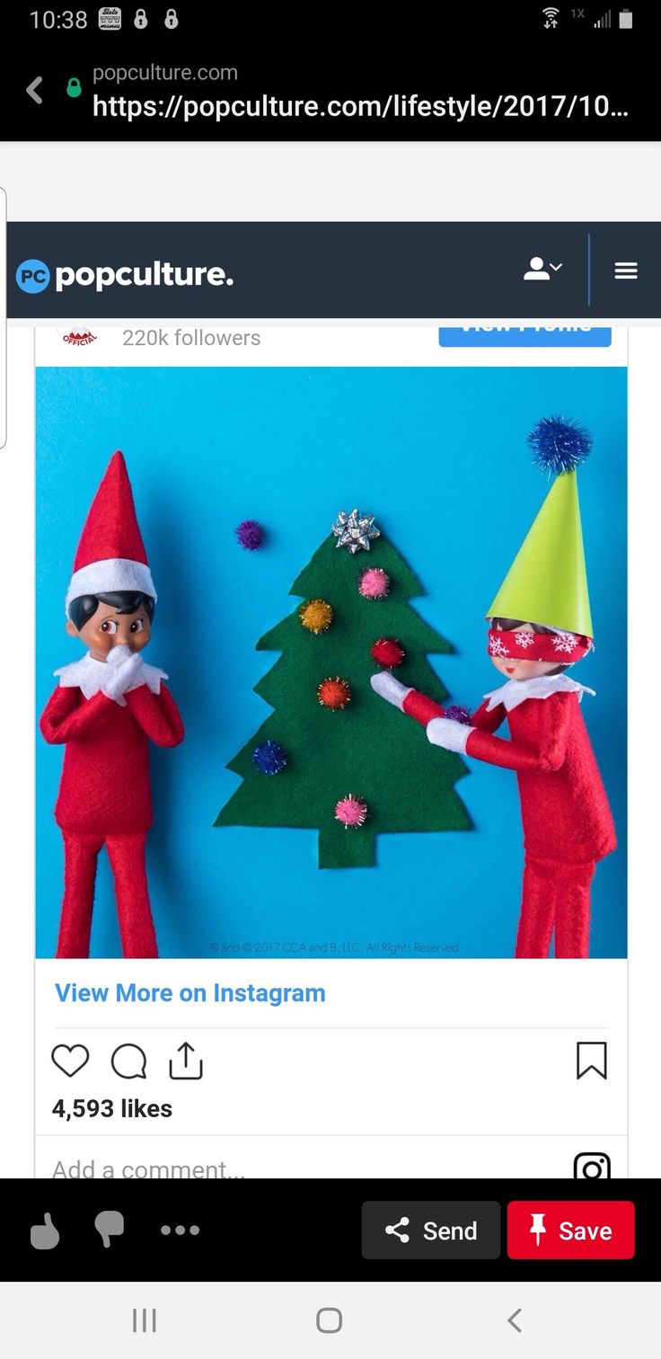 an image of two elfs in front of a christmas tree on the facebook page