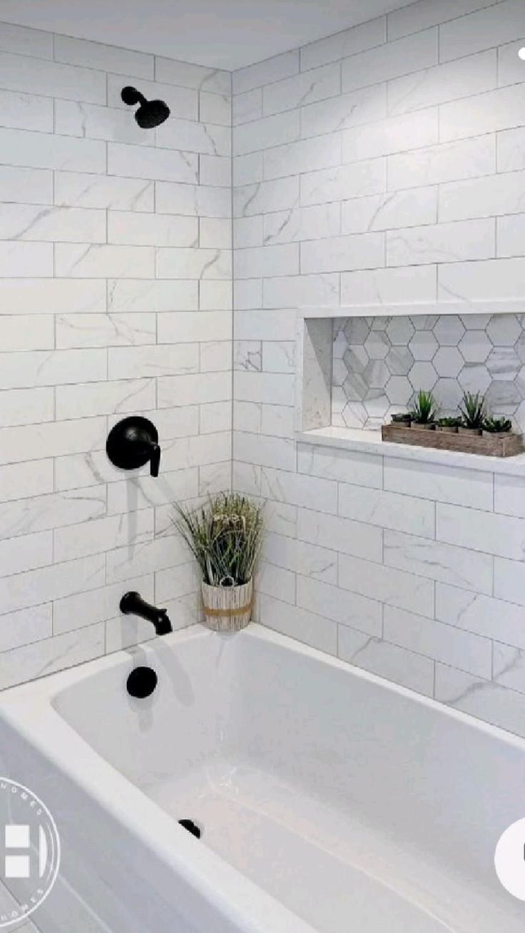 a bathroom with white tile and black accents on the walls is featured in an ad for kids'bath