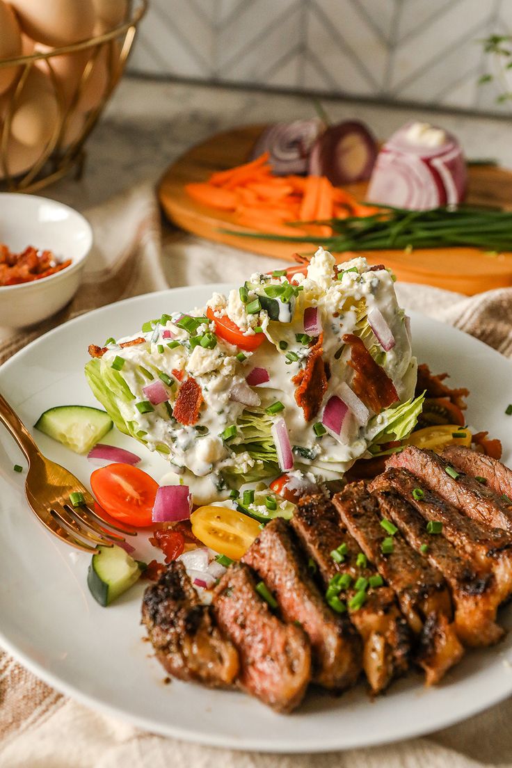 a white plate topped with meat and veggies