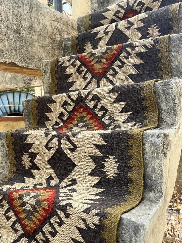 an old carpeted set of stairs leading up to a building