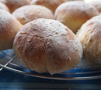 several loaves of bread sitting on a cooling rack