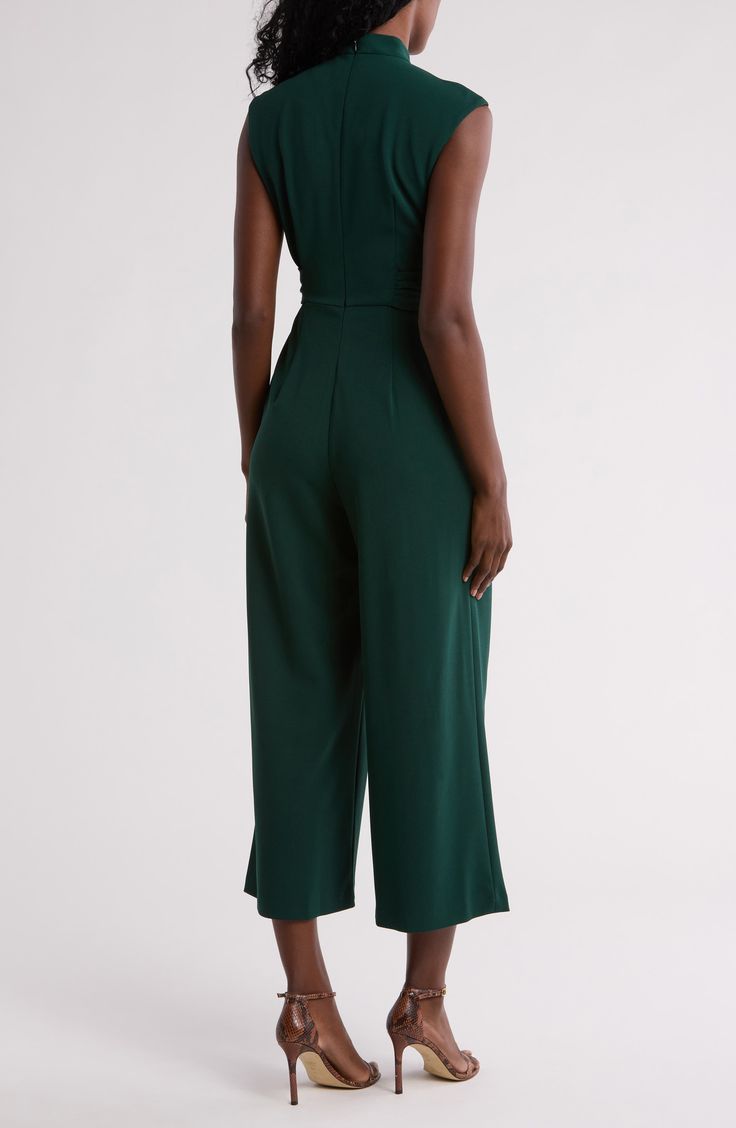 A contrasting buckle defines the waist of this woven jumpsuit that's cut right at your ankle for trend-right charm. 25 1/2" inseam Hidden back-zip closure Mock neck
 Cap sleeves Side-seam pockets Removable waist tie 66% polyester, 30% recycled polyester, 4% spandex Dry clean Imported Fitted Calvin Klein Jumpsuits And Rompers For Party, Fitted Belted Strapless Jumpsuit, Belted Strapless Jumpsuit For Workwear, Workwear Jumpsuits And Rompers With Belt Loops, Chic Belted Strapless Jumpsuit For Work, Chic Belted Green Jumpsuits And Rompers, Chic Green Belted Jumpsuits And Rompers, Chic Green Belted Jumpsuit, Green Fitted Jumpsuits And Rompers For Work