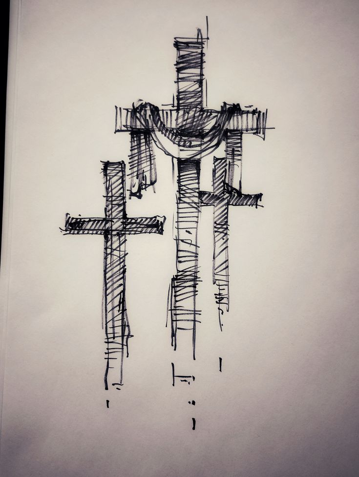 a drawing of a cross on top of a piece of paper