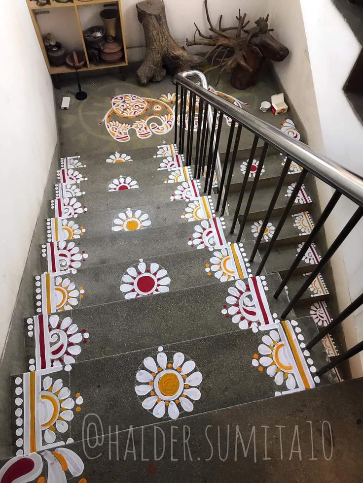 the stairs are painted with colorful designs and patterns on them, along with other decorative items