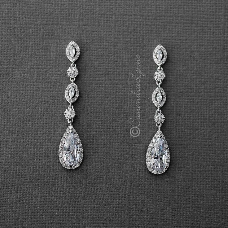 Dazzle your ears with these elongated pear or teardrop CZ dangle earrings. These earrings are a fabulous choice for weddings, proms, homecomings or any special occasion in need of some extra sparkle! Pierced post backs and 2 1/8 inches long. Rhodium plated, gold plated or rose gold plated, grade AAA cubic zirconia and lead free. Go here for the matching pendant! Diamond Teardrop Earrings, Dangling Diamond Earrings, Christian Jewellery, Wedding Earrings Vintage, Diamond Earrings Design, Wedding Day Jewelry, Jewel Wedding, Prom Earrings, Bride Earrings