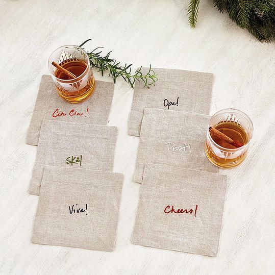 three placemats with different types of tea and cinnamon on them sitting on a table