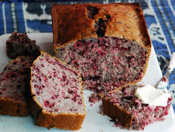 a loaf of raspberry bread cut in half