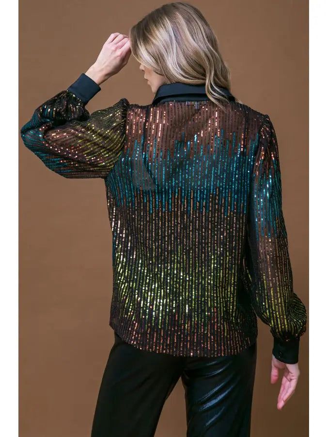 This sparkling sequin blouse is sure to make you the life of the party! With its shirt collar, long sleeve, and cami design, you'll be ready to ring in the new year in style! Perfect for holiday parties and turning heads all night long. Trendy Sequined Blouse For Party Season, Glamorous Holiday Tops With Contrast Sequin, Contrast Sequin Long Sleeve Tops For Night Out, Long Sleeve Tops With Contrast Sequin For Night Out, Glamorous Contrast Sequin Tops For Holidays, Trendy Night Out Blouse For Party Season, Glamorous Holiday Tops For Date Night, Formal Long Sleeve Tops For Party Season, Trendy Blouse For Night Out Party Season