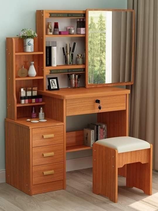 a wooden desk with a mirror, stool and shelf on it in front of a window