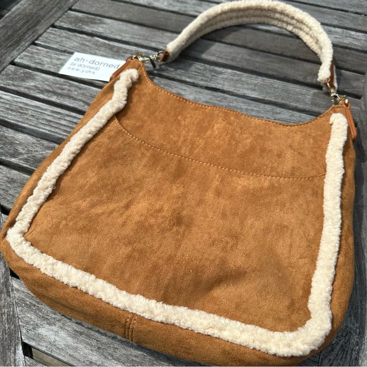 This Vegan Sherpa And Suede Ahdorned Messenger Bag Is Fantastic. New With Tags This Super Soft Bag Has Two Straps One Shorter Sherpa Strap And One Long Crossbody Nylon Strap. See Pictures For Condition And Measurements. If You Are A Newcomer To Poshmark, Use This Referral Code When You Create An Account For $10 Credit Towards Your First Purchase. Kikisattik Brown Everyday Bag For Winter, Everyday Brown Winter Bag, Winter Travel Brown Shoulder Bag, Camel Tote Shoulder Bag For Errands, Winter Brown Satchel Shoulder Bag, Brown Shoulder Bag Satchel For Winter, Brown Double Handle Shoulder Bag For Winter, Brown Winter Shoulder Bag Satchel, Winter Brown Shoulder Bag With Double Handle