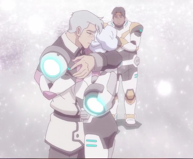 an anime character holding another character in his arms