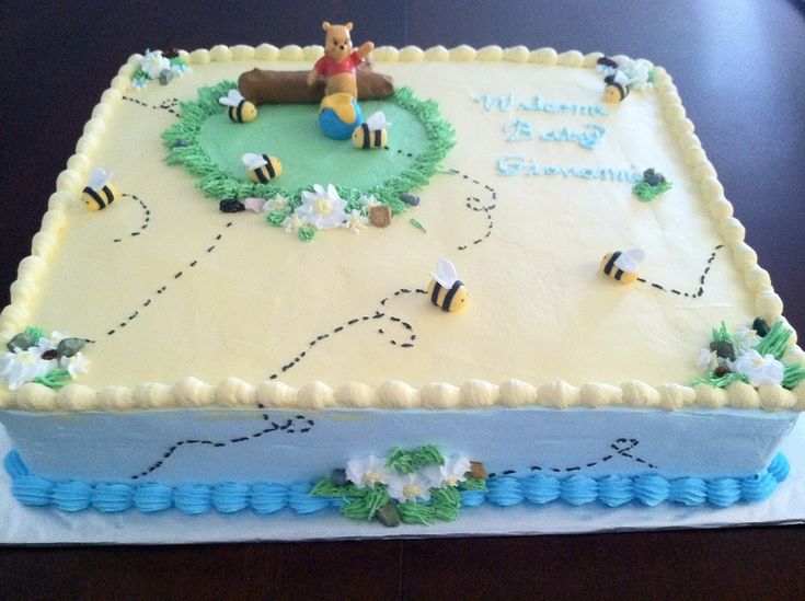 a winnie the pooh birthday cake on a table