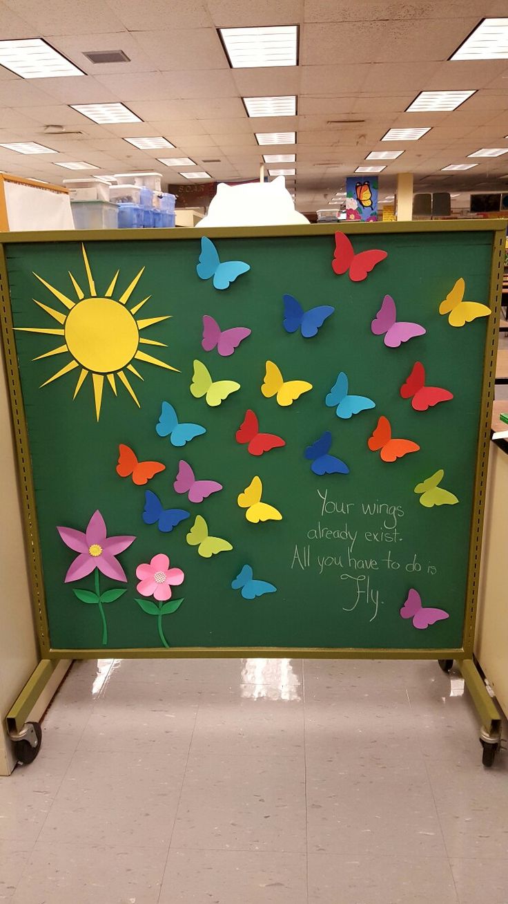 a bulletin board with colorful butterflies on it