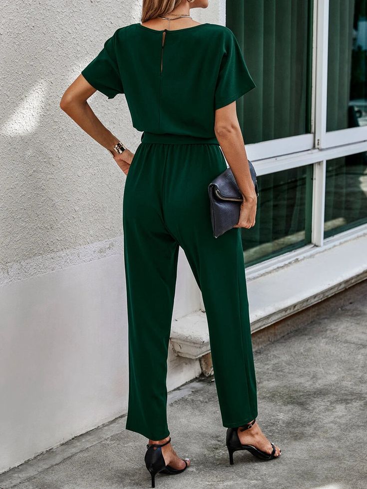 Dressing up for a wedding, gala, or any other special occasion is a breeze in the jumpsuit. A flattering fit that highlights your contours is provided by the belted waist, which also gives a feminine touch with its dark green color. The Keyhole Back Jumpsuit allows for free mobility and flexibility because of its regular fit and comfy materials, enabling you to dance the night away without any difficulty. Features: Color: Dark Green Style: Casual Pattern Type: Plain Details: Belted, Cut Out Length: Long Type: Tee Fit Type: Regular Fit Neckline: Round Neck Sleeve Length: Short Sleeve Sleeve Type: Batwing Sleeve Waist Line: High Waist Fabric: Medium Stretch Jumpsuits Material: Fabric Jumpsuits Composition: 95% Polyester, 5% Elastane Care Instructions: Machine wash or professional dry clean J Style Vert, Stretch Jumpsuit, Comfy Jumpsuits, Dark Green Color, Green Style, Batwing Sleeve, Green Fashion, Green Color, Green Colors