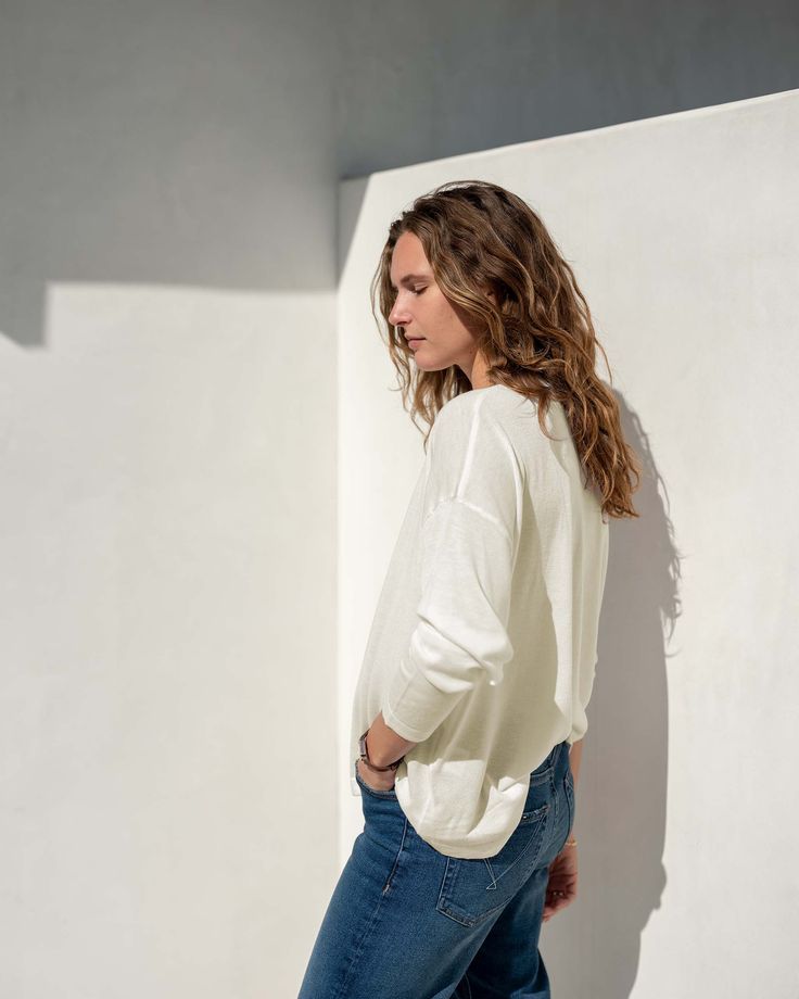 Lighter than a sweater, heavier than a long-sleeve tee—the Delmar Sweater is the softest cross between the two you will find. This piece is inspired by the sunny SoCal city Del Mar, San Diego and made to keep you comfortable in any breeze. The classic crewneck and drop shoulder drape perfectly to your shape and can be styled with shorts, white jeans or a swimsuit. This is a sweater your closet will thank you for. Details Crafted of the softest of yarns An everyday staple for layering or wearing Relaxed Sweater For Layering, Relaxed Layering Sweater, Cream Knit Top For Everyday Fall Wear, Relaxed Fit Fine Knit Sweater For Layering, Cozy Sweater For Casual Gatherings In Spring, Winter White Relaxed Fit Casual Sweater, Winter White Relaxed Casual Sweater, Casual Winter White Crew Neck Top, Cozy Sweater For Casual Spring Gatherings