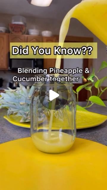 a blender filled with yellow liquid sitting on top of a counter