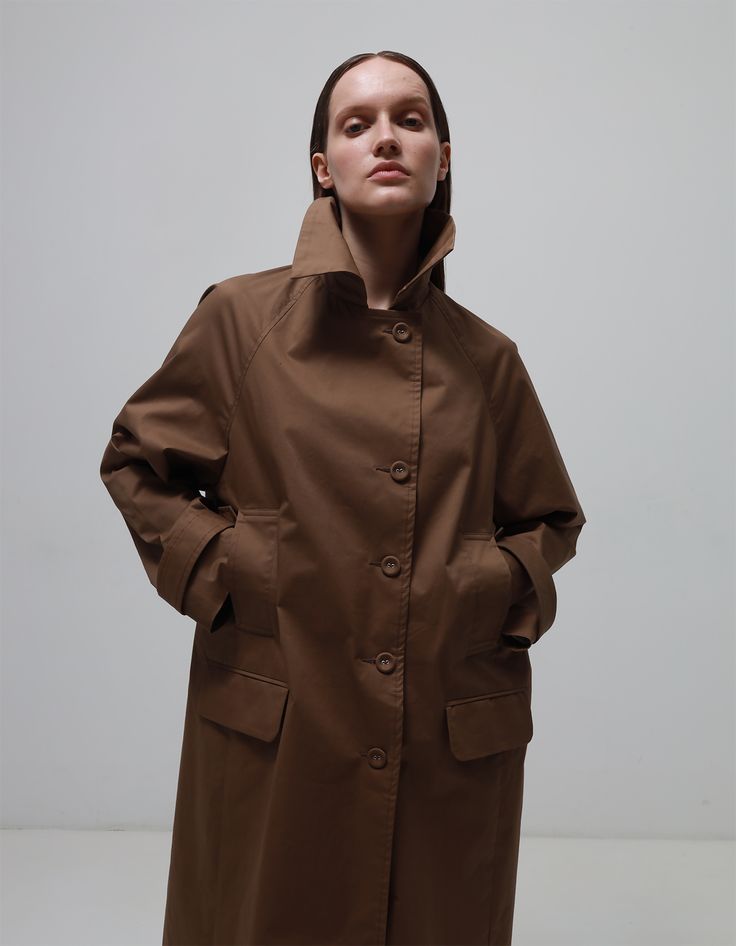 Made from high-quality material, this trench coat guarantees a unique look with its deep brown colour. A straight cut with clean lines and structured details create a sophisticated silhouette, complementing your look with every move.Buttons trimmed in the same colour as the base material add extra elegance and style to the trench coat. This trench coat is not just an outfit - it is an expression of your personality and understanding of true style. Dense material protects from the wind.Material 1 Brown Trench Coat, Brown Colour, Deep Brown, Straight Cut, The Wind, Clean Lines, Brown Color, Trench Coat, High Quality