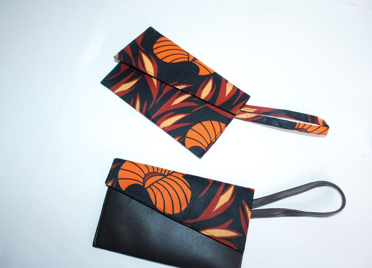 Introducing our stylish and versatile wristlet bag, beautifully crafted with warm toned Autumn Leaves Ankara cotton fabric. This eye-catching design combines traditional African prints with contemporary fashion, making it a perfect statement accessory for any occasion. Product Features: Unique Ankara Print:  The bag showcases a bold geometric pattern inspired by African Ankara fabrics, ensuring you stand out in the crowd with a touch of cultural elegance. Premium Quality:  Handmade with love and precision, using high-quality Ankara cotton fabric that is both durable and lightweight for everyday use. Convenient Size: Our wristlet bag offers just the right amount of space to carry your essentials, such as keys, phone, cash, and cosmetics, keeping you organised and chic. Eco-Friendly: Made wi Pouch Clutch With Card Slots, Brown Pouch With Wrist Strap For Daily Use, Clutch Bags With Wrist Strap As Gifts, Rectangular Pouch With Detachable Strap For Gift, Pouch Wallet With Wrist Strap As Gift, Daily Use Clutch Bag With Wrist Strap, Clutch Wristlet With Removable Pouch For Personal Use, Brown Wristlet Clutch With Card Slots, Daily Use Clutch With Wrist Strap