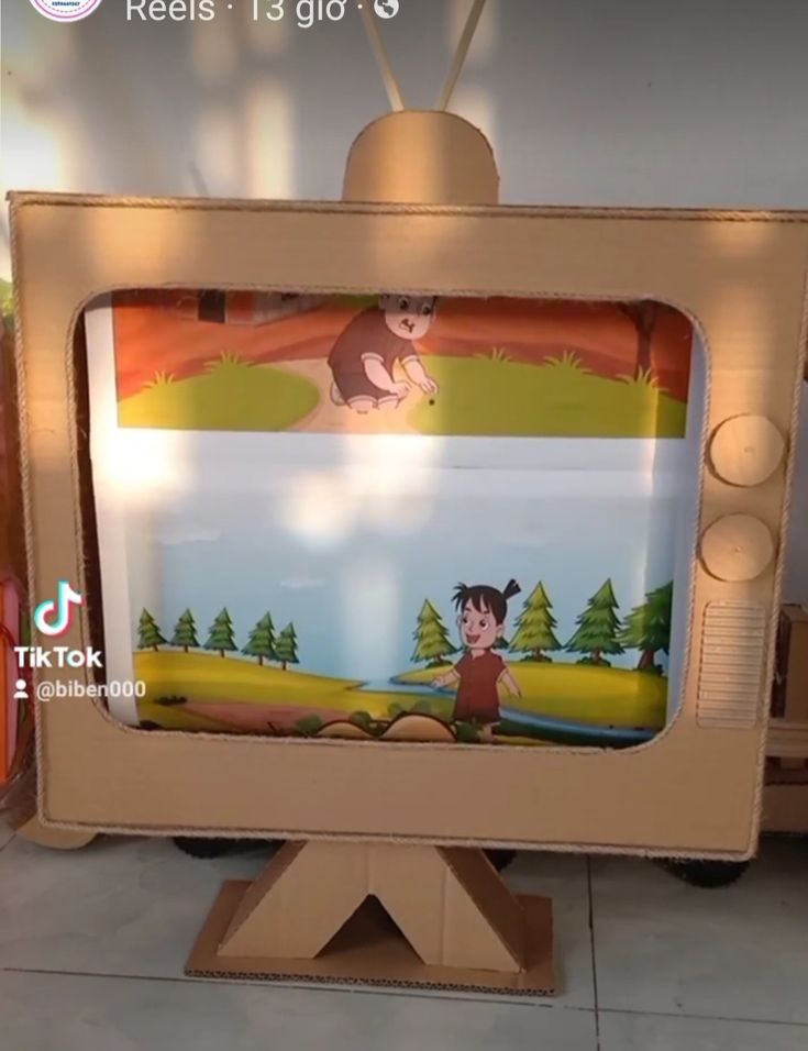 an old tv sitting on top of a wooden stand