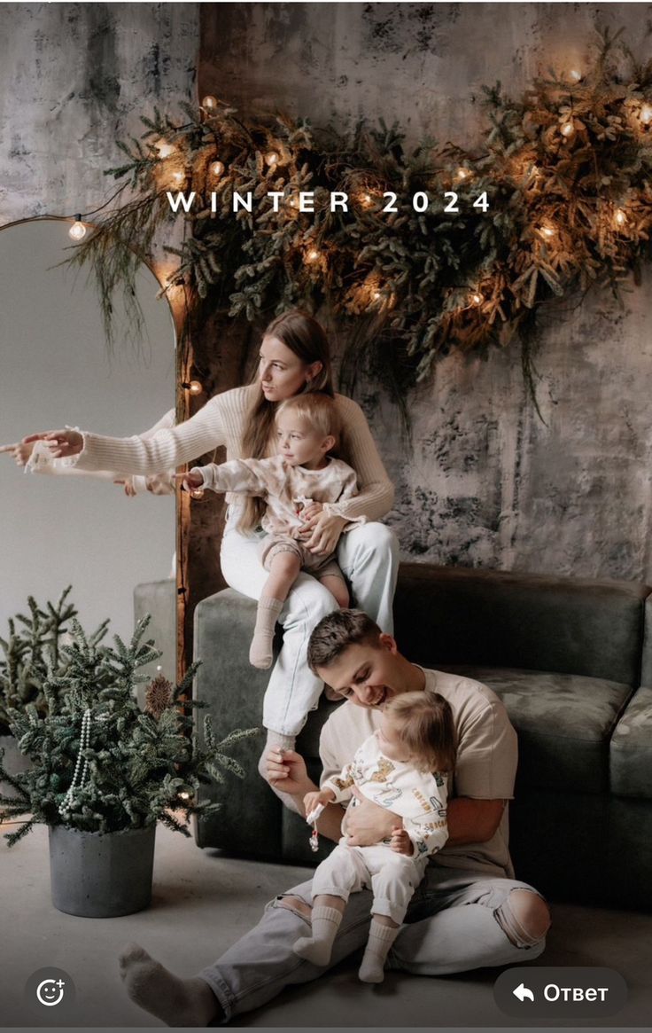 a family sitting on a couch in front of a christmas tree with the caption winter 2024