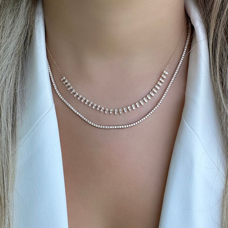 The mini version of our popular 14K gold tribal baguette drop diamond necklace. It offers an eye-catching look that will elevate any outfit. Handcrafted to ensure exceptional quality, this necklace features a unique combination of baguette and round diamonds, set in a tribal design that will add character and sparkle to any look. The luminous baguette diamonds capture the light beautifully, making it an elegant piece that is sure to become a timeless keepsake. Item Information Metal: 14k Gold We Luxury Elegant Jewelry With Baguette Diamonds, Luxury Minimalist Jewelry With Baguette Diamonds, Luxury Evening Baguette Diamond Necklaces, Luxury Baguette Diamond Wedding Necklaces, Luxury Evening Diamond Necklace With Baguette Diamonds, Luxury Evening Jewelry With Baguette Diamonds, Luxury Delicate Baguette Cut Jewelry, Luxury Silver Diamond Necklace With Baguette Diamonds, Luxury Baguette Cut Single Diamond Necklace