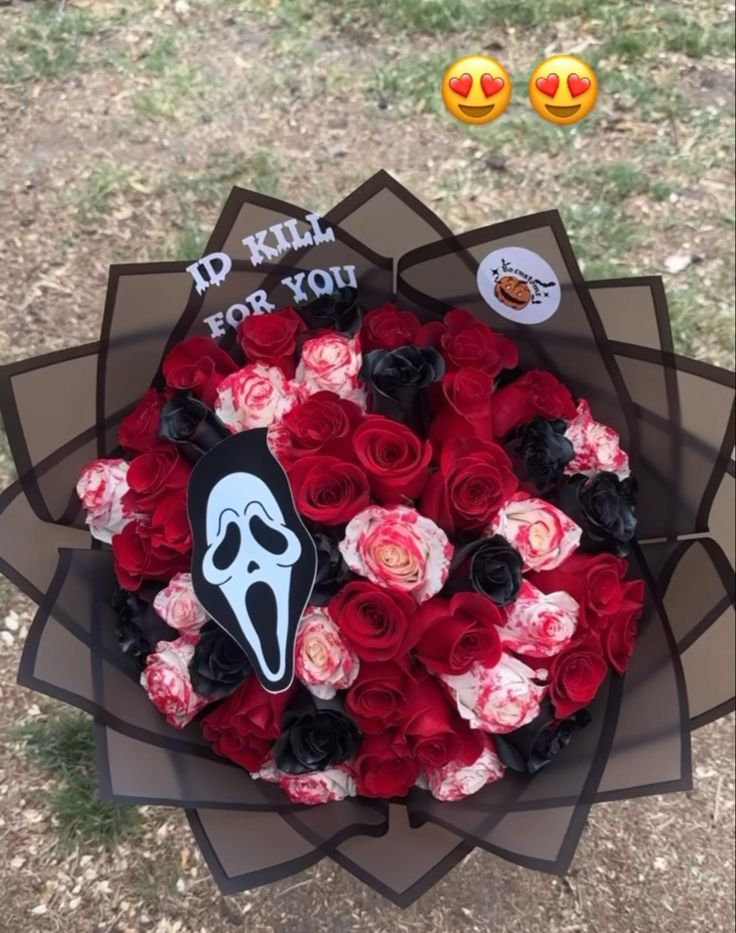 a bouquet of red and pink roses with a ghost sticker on the top that says, i'd kill for you